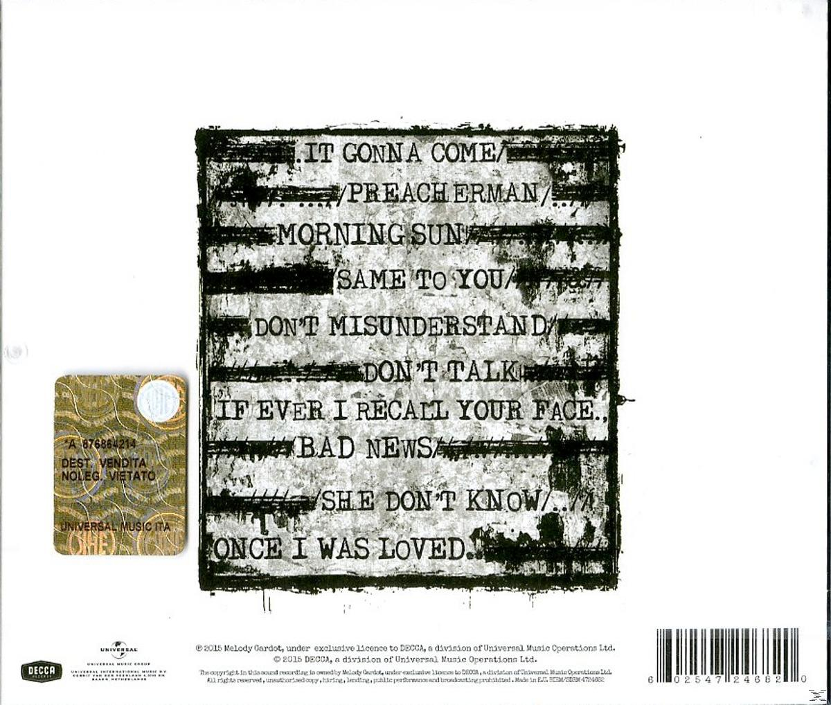 Albumcover mit Titeln. Schwarzer Text auf weißem Hintergrund. Aufkleber in der linken Ecke.