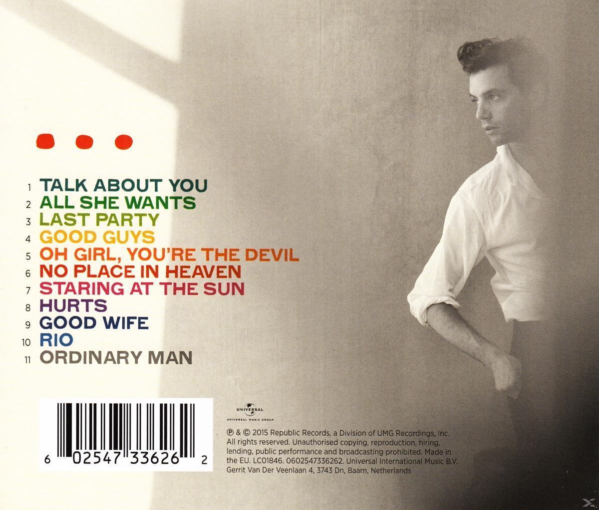 Albumcover mit Songtiteln und einem Mann. Der Mann ist rechts, blickt nach links mit einem weißen Hemd.