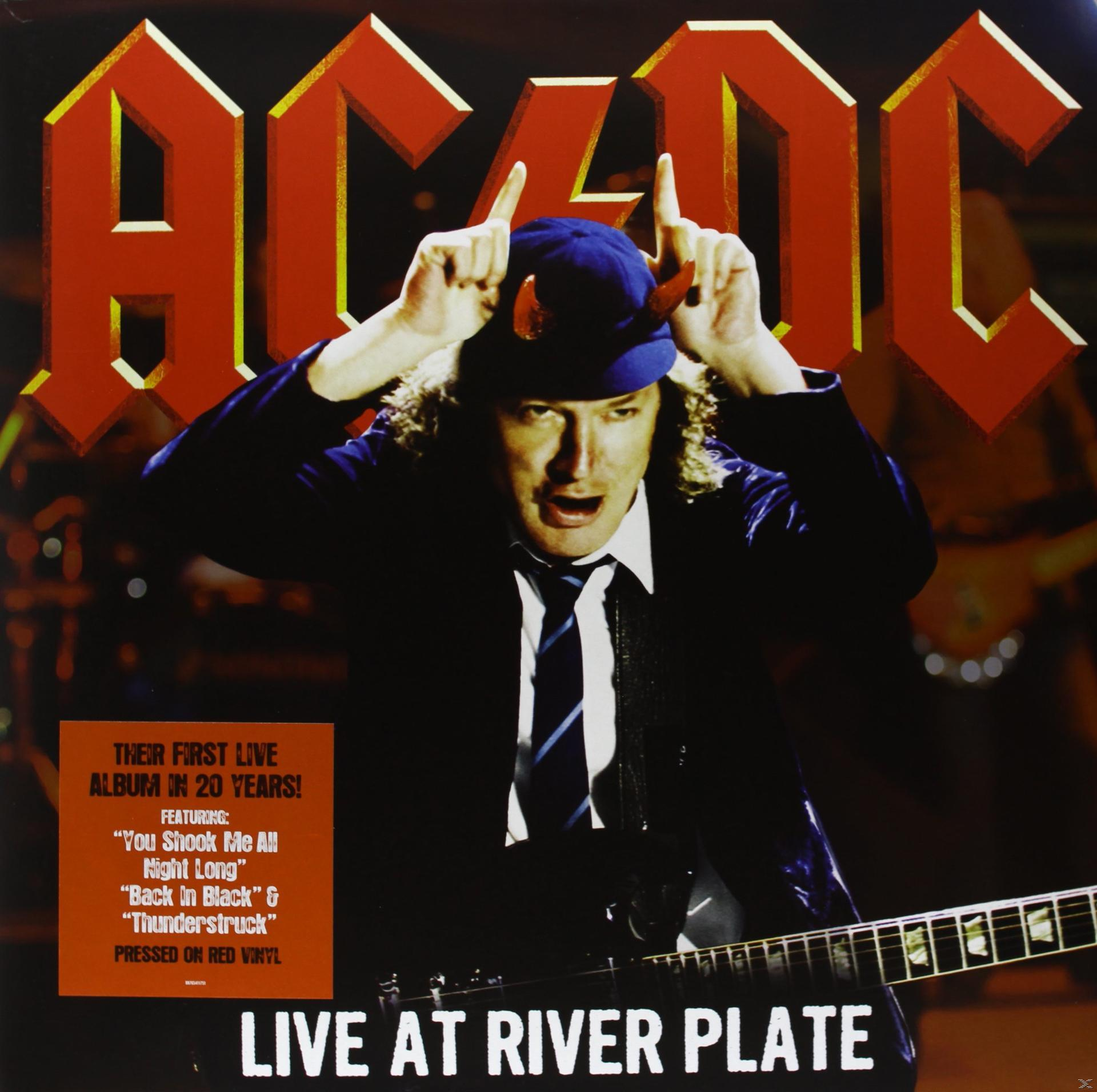 AC/DC album borító: Angus Young ördögszarvakkal, gitározik a színpadon.