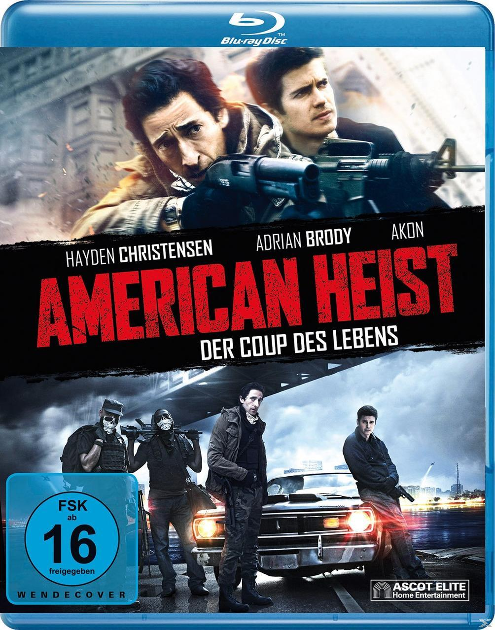 DVD-Cover mit zwei Männern in einem Auto. Text oben. Leute mit Waffen unten.