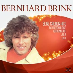 Albumcover eines Mannes mit lockigem Haar. Roter Hintergrund mit weißem Text oben.