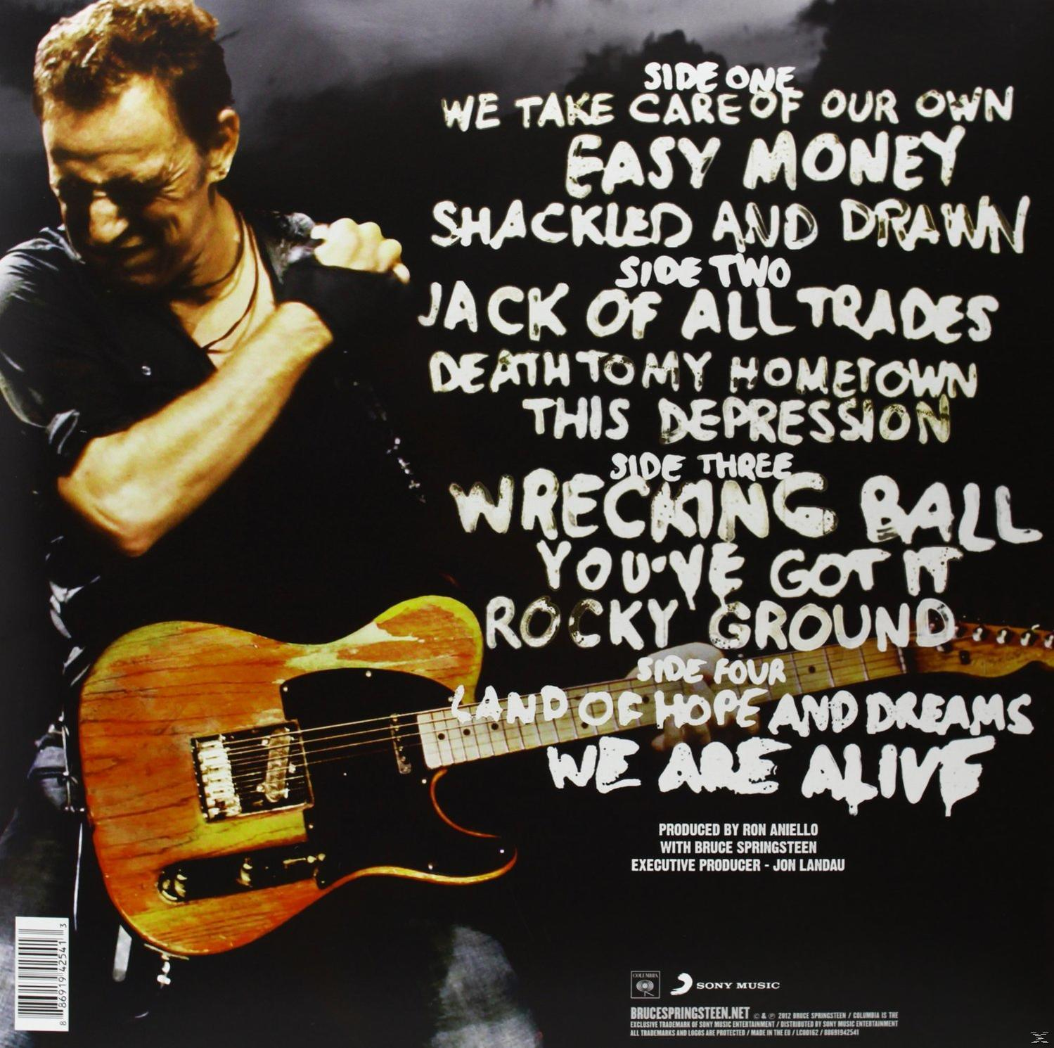 Album-Rückseite. Bruce Springsteen, Gitarre, Songtitel. Schwarzer Hintergrund. Sony Music Logo.