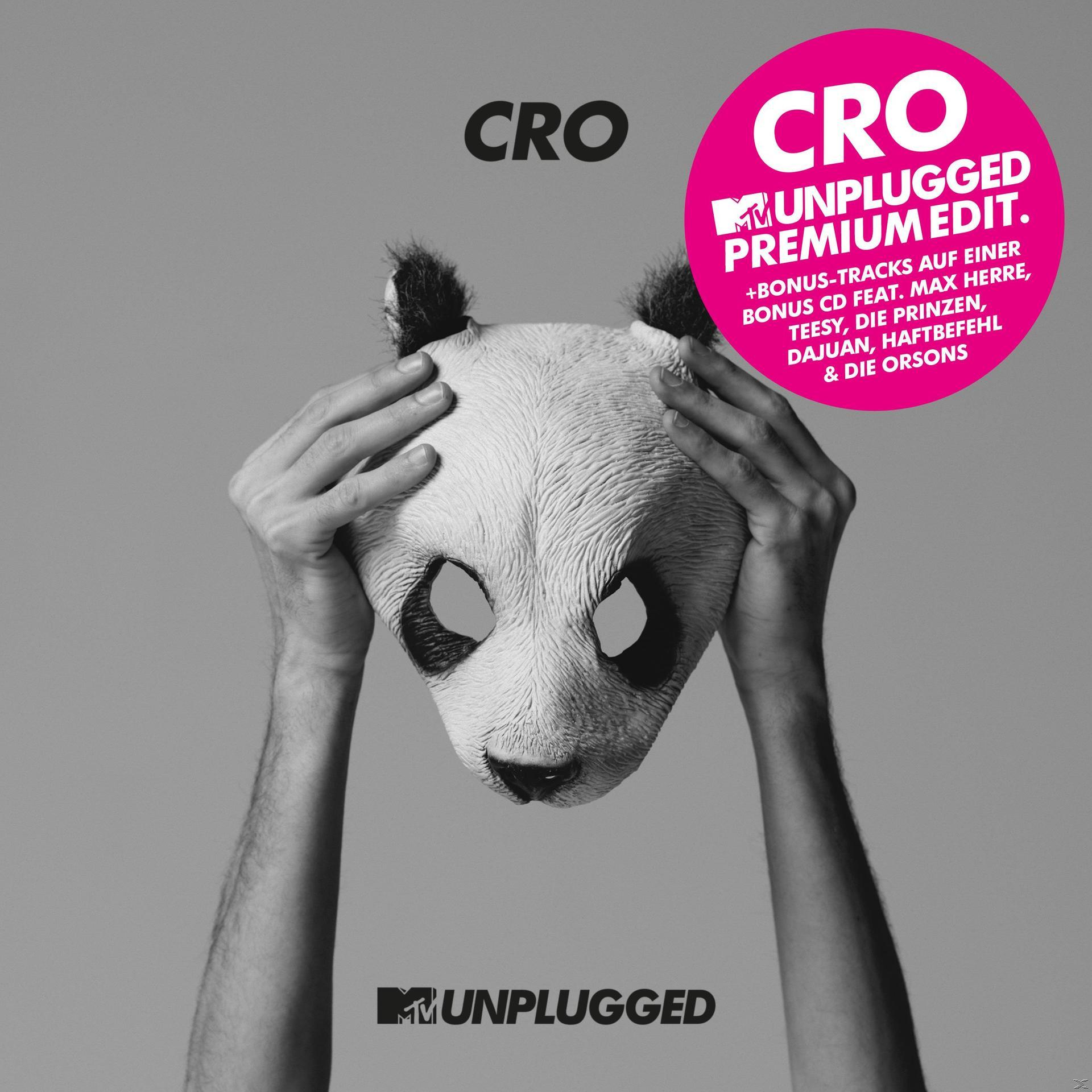Albumcover: 'CRO'. Person hält Pandamaske. Rosa Kreistext 'Unplugged Premium Edit'.