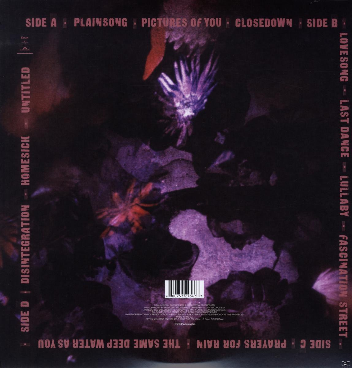 Album borítója lila és sötét árnyalatokkal. A szöveg a dalok címeit és a The Cure zenekar nevét tartalmazza.