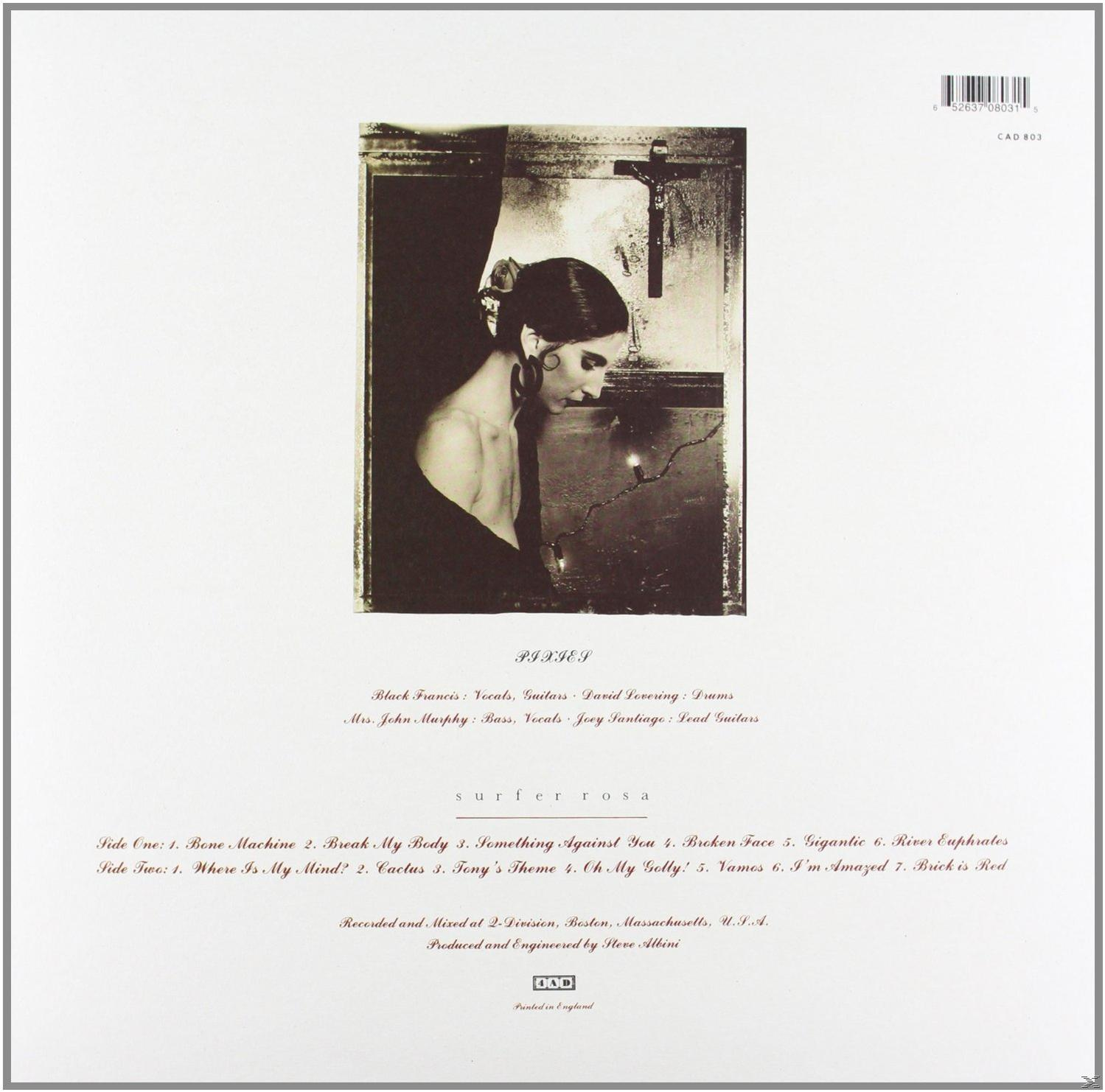 Album hátlapja. Fekete ruhás nő és egy kereszt. Album címe: SURFER ROSA.