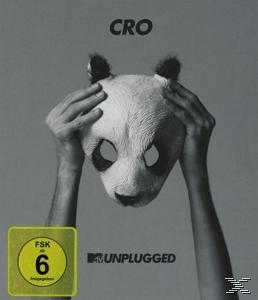 Schwarz-Weiß-Bild einer Person, die eine Pandamaske vor ihrem Gesicht hält.