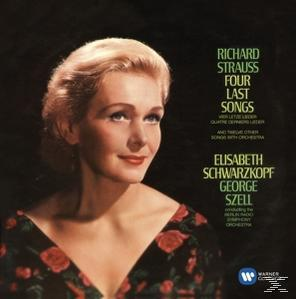 Albumcover mit einer Frau. Sie lächelt. Text steht oben. Sie trägt ein schwarz-rotes Kleid.