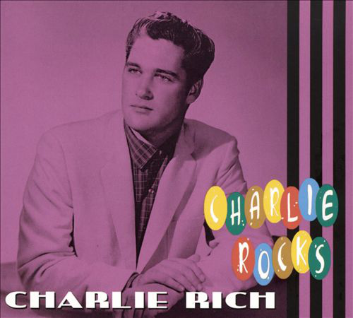 Album borító egy férfival világos rózsaszín öltönyben. A cím: 'Charlie Rocks' alul.