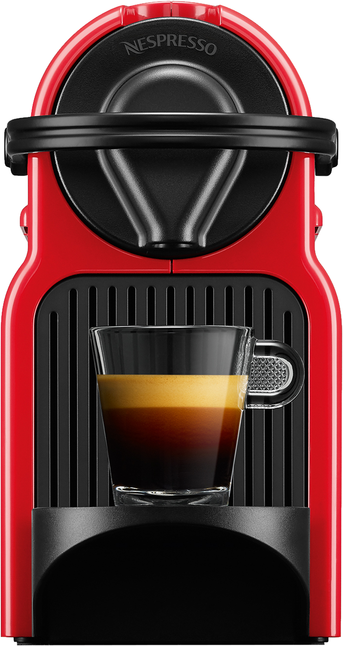 Egy piros Nespresso kávéfőző egy pohár kávéval előtte.