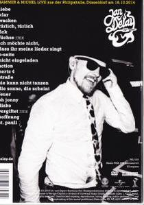 Albumcover: Mann mit Sonnenbrille und Hut, lächelnd. Schwarz und Weiß mit deutschem Text.