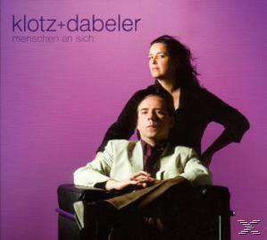 Albumcover: 'klotz+dabeler', Mann und Frau, violetter Hintergrund.