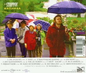 Albumcover mit einer Gruppe von Menschen unter Regenschirmen. Titel ist 'Wellness', Songtitel unten.