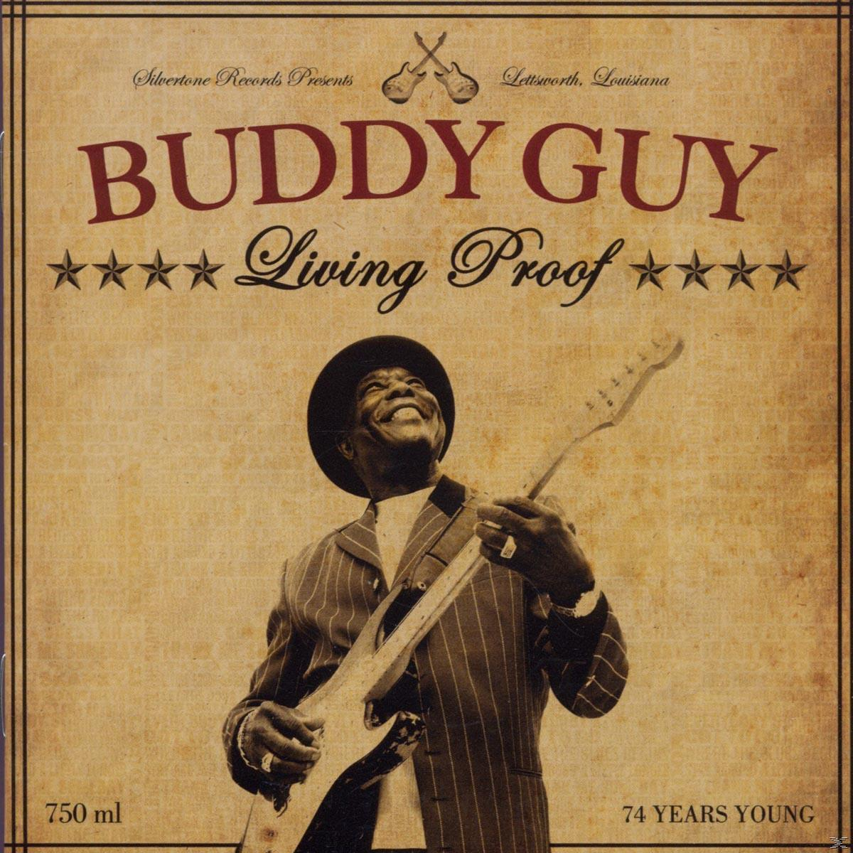Album borító Buddy Guy-jal gitározva. A szöveg szerint 'Buddy Guy', 'Living Proof', és '74 Years Young'.
