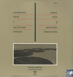Albumcover mit Titelliste und Luftaufnahme von kreisförmigen Feldern. Braune und grüne Farben.