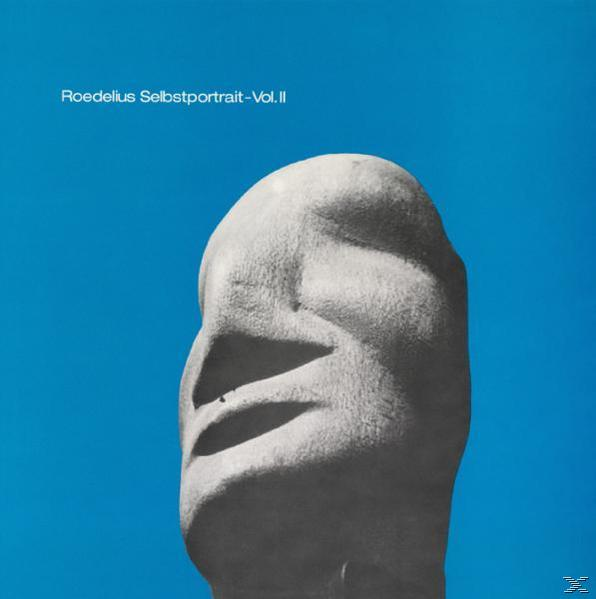 Albumcover: Steingesicht vor blauem Hintergrund.