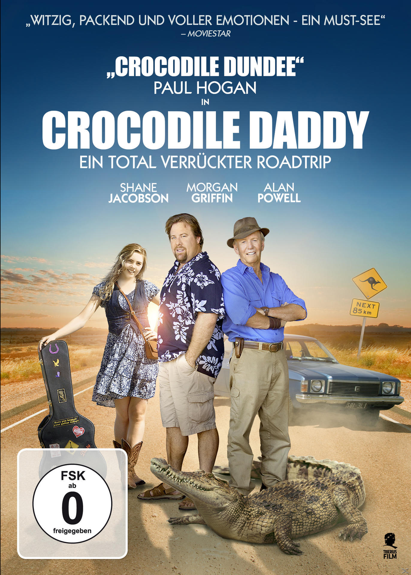 DVD-Cover für "Crocodile Daddy" mit drei Personen und einem Krokodil. Ein Auto und eine Straße sind sichtbar.