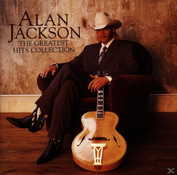 Albumcover: ein Mann im Anzug sitzt und eine Gitarre hält.