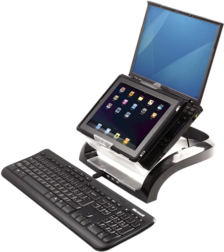 Tablet in a stand with a keyboard. Display up. Black stand and keyboard. White background.