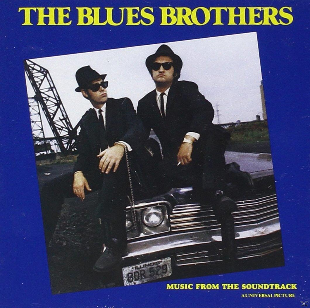 Albumcover. Zwei Männer in schwarzen Anzügen und Hüten sitzen auf einem Auto. Text: 'THE BLUES BROTHERS'.