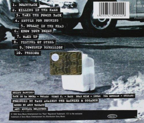 Albumcover mit Trackliste, Auto. Der Hintergrund hat eine weiße Box und ein Auto.