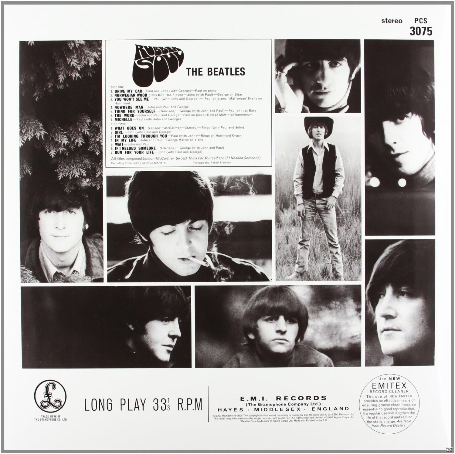 De albumhoes van The Beatles met meerdere afbeeldingen van de bandleden en een tracklist.