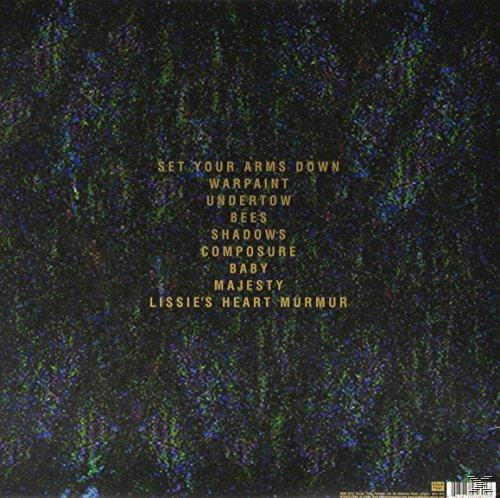 Album hátlapja számlistával és színes, absztrakt háttérrel.