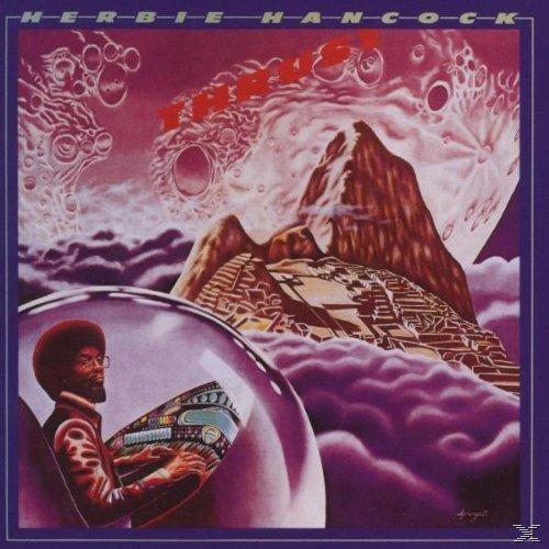 Album borító űrtémával, Herbie Hancock nevével és egy zenész illusztrációjával.
