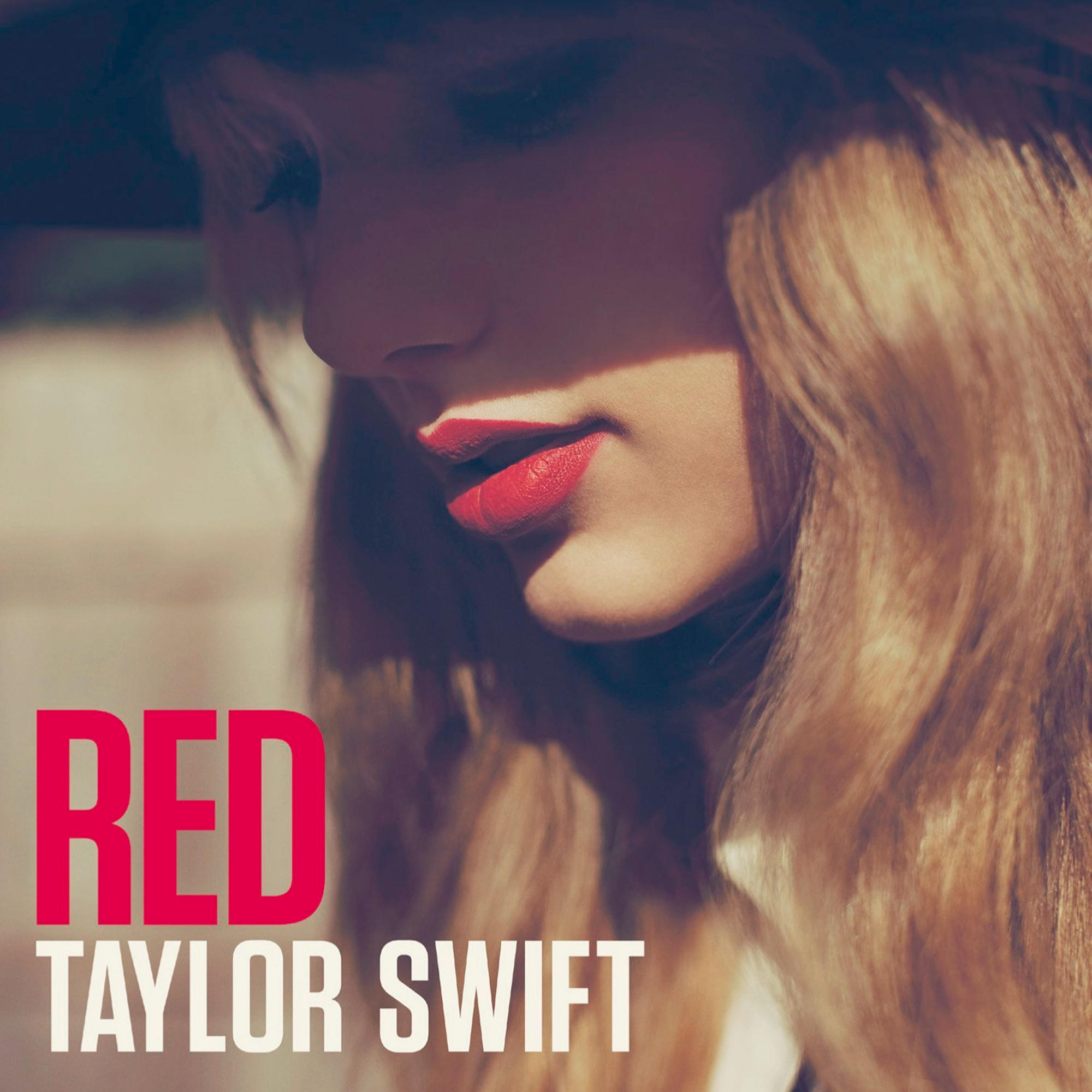 Album cover with the word 'RED' in large letters, and 'TAYLOR SWIFT' below, on a red background.