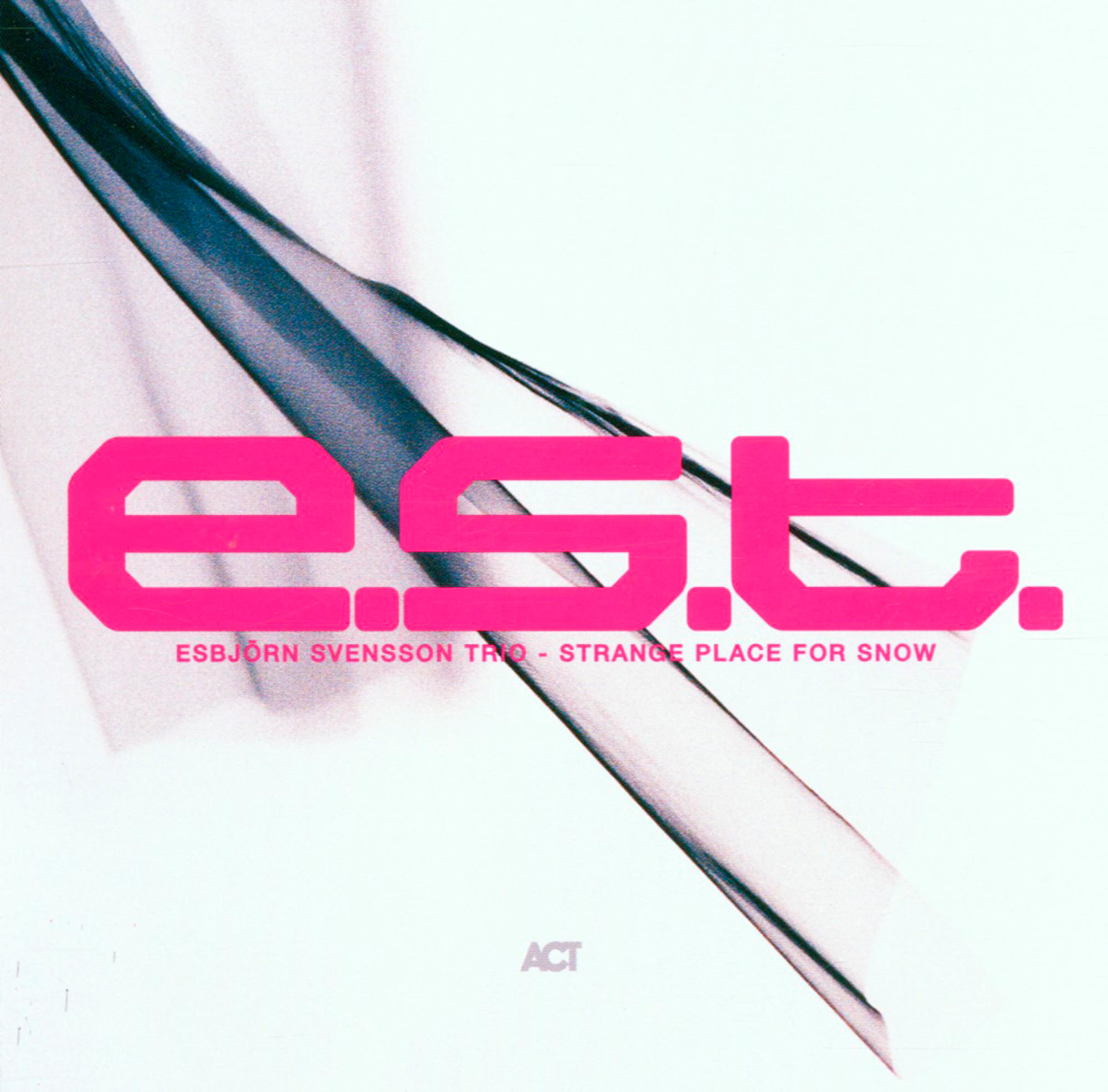 Albumcover mit rosa Schriftzug 'e.s.t.' und Titel. Hintergrund hat ein verschwommenes, abstraktes Design.
