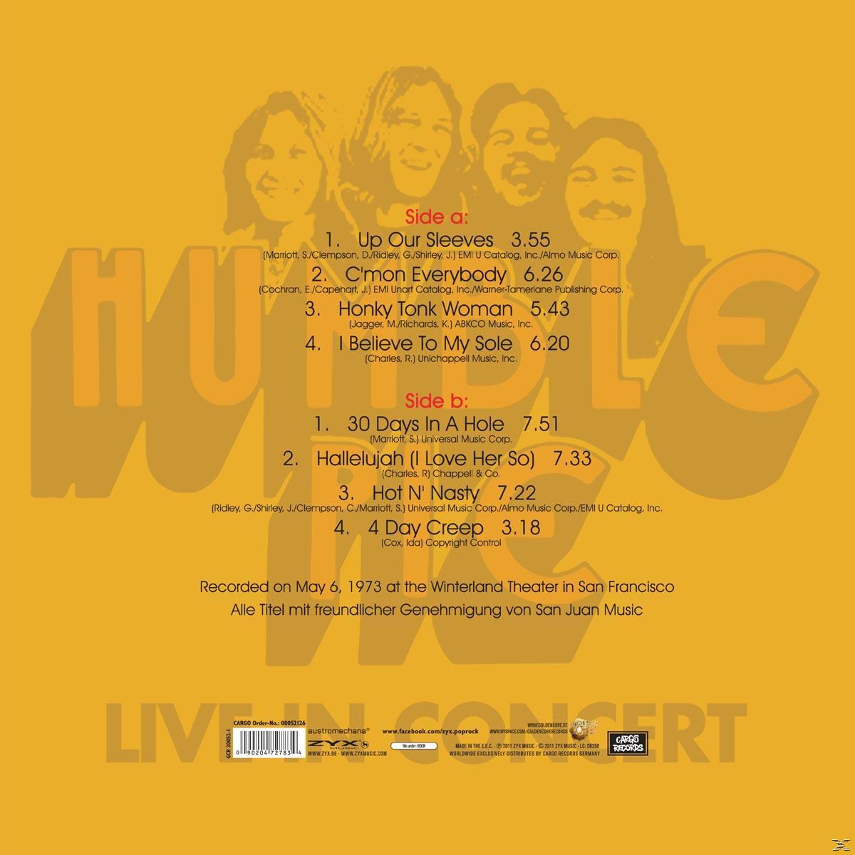 Albumrückseite mit Titelliste und Bandbild.