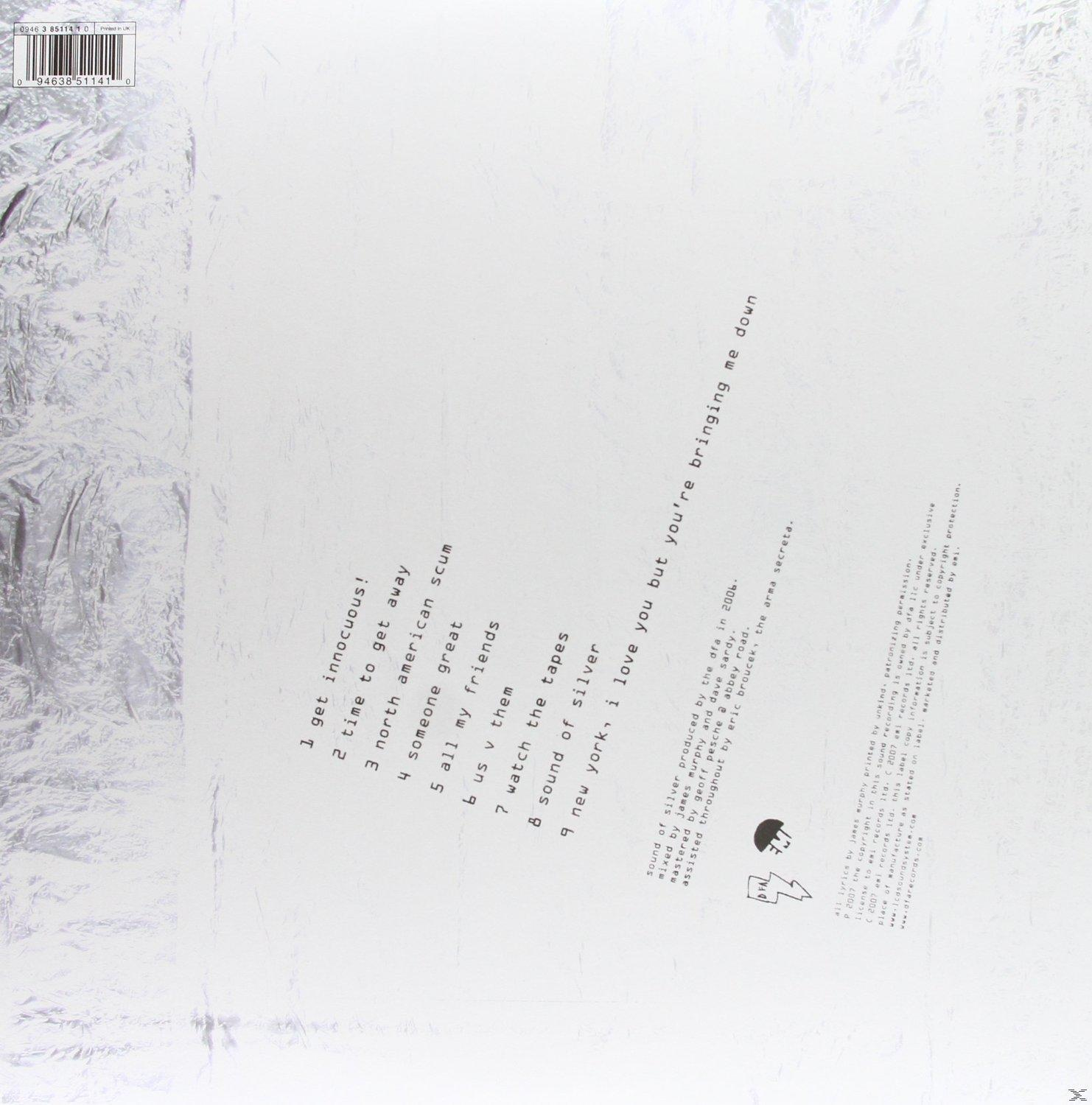 Rückseite eines silbernen Albums mit Titelliste und Credits. Weißer Hintergrund.