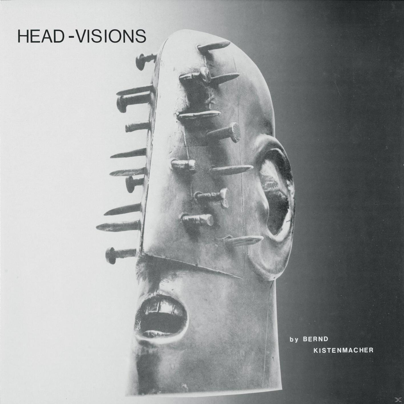 Albumcover: Eine Skulptur eines Gesichts mit herausragenden Nägeln, Titel ist HEAD-VISIONS.