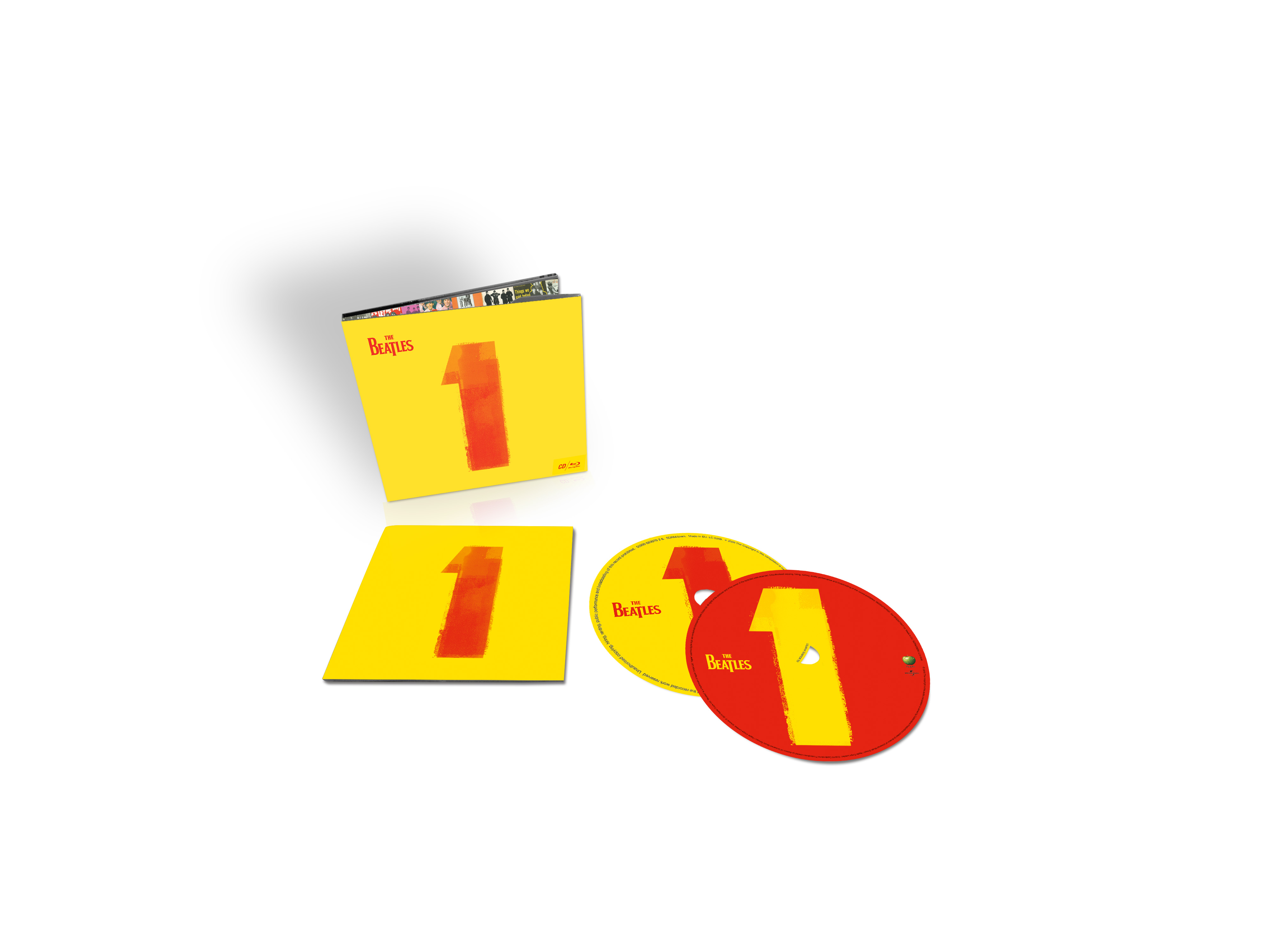 Gelbe Box mit der Nummer '1'. Zwei CDs und eine gelbe Matte sind ebenfalls sichtbar.