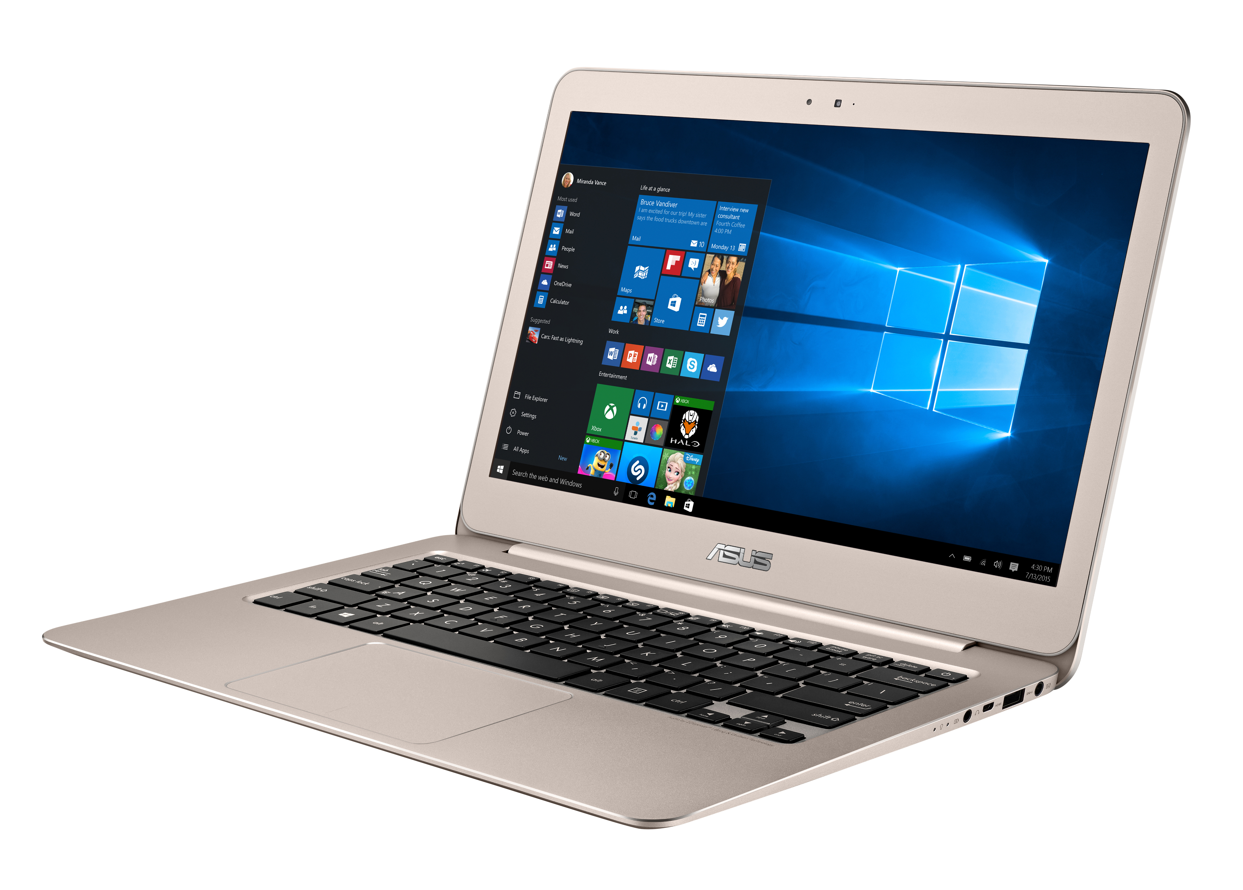 Ein goldener Asus Laptop steht offen auf einer weißen Oberfläche und zeigt den Windows 10 Startbildschirm.