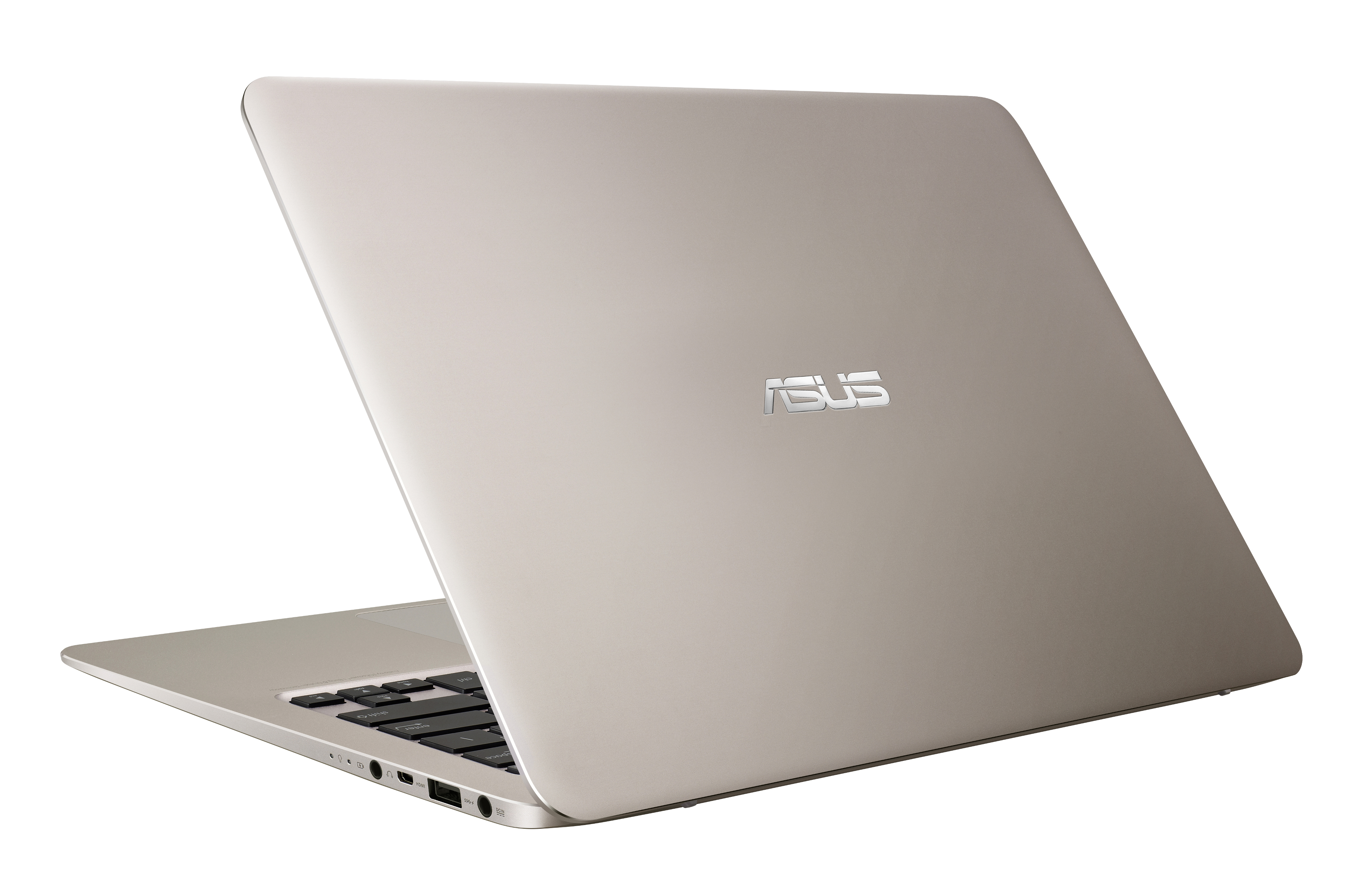 Ein schlanker, goldener Asus-Laptop steht auf einer weißen Oberfläche, die Tastatur ist teilweise sichtbar.