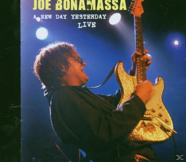 Joe Bonamassa DVD borítója, élő előadás gitárral.