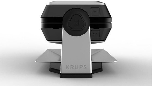 Top view of a black and silver Krups waffle maker. The top is closed.
