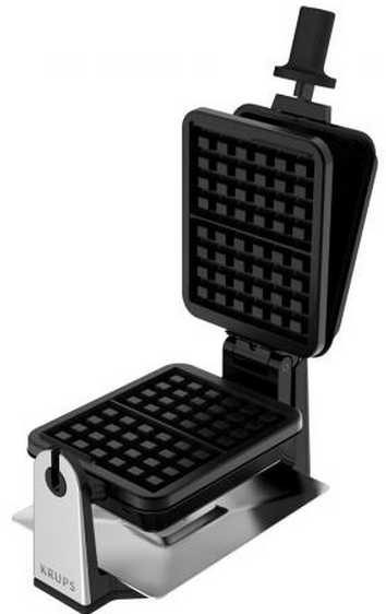 A black and silver waffle maker, open. The interior has a grid pattern.