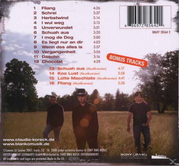 Albumcover zeigt drei Bandmitglieder vor einem grünen Feld, Album-Trackliste und Bonustracks.