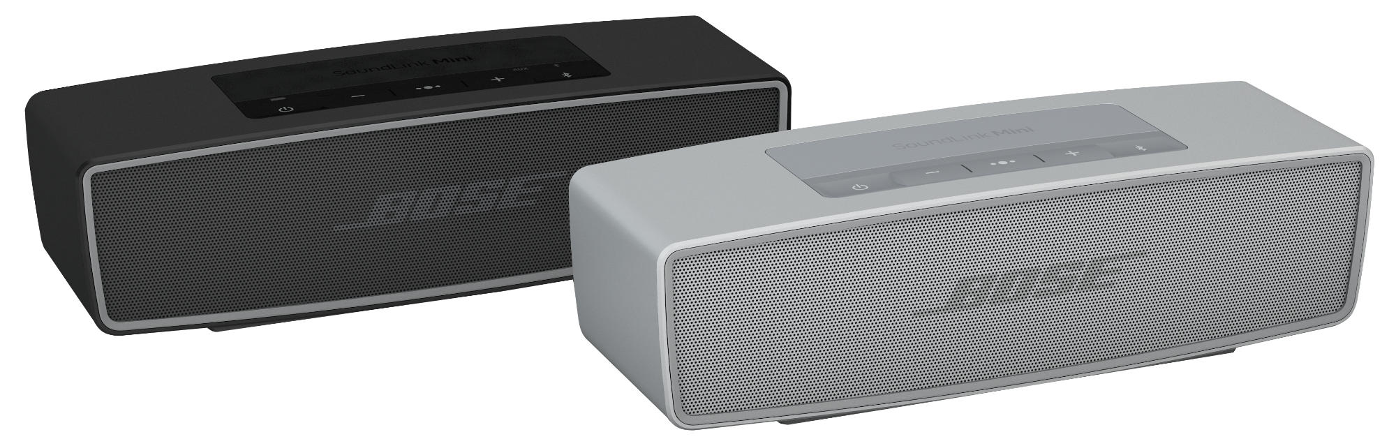 Zwei Bose SoundLink Mini-Lautsprecher, einer schwarz, einer grau. Beide haben Bedienfelder. Die Front hat ein perforiertes Metallgitter.