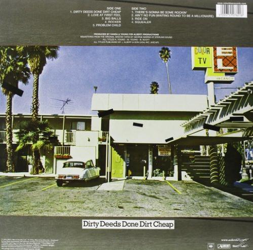 Albumcover mit einem Gebäude, Palmen und Text.