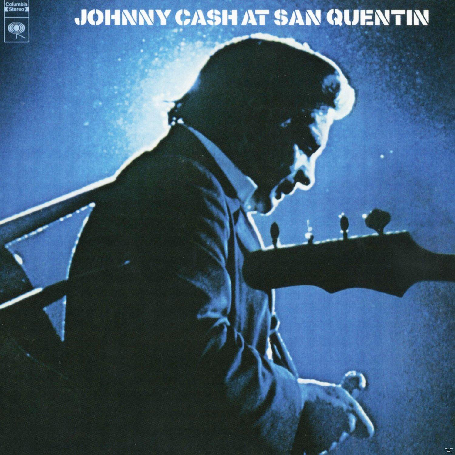 Johnny Cash spielt Gitarre auf der Bühne, blaue Bühnenbeleuchtung. Albumcover.