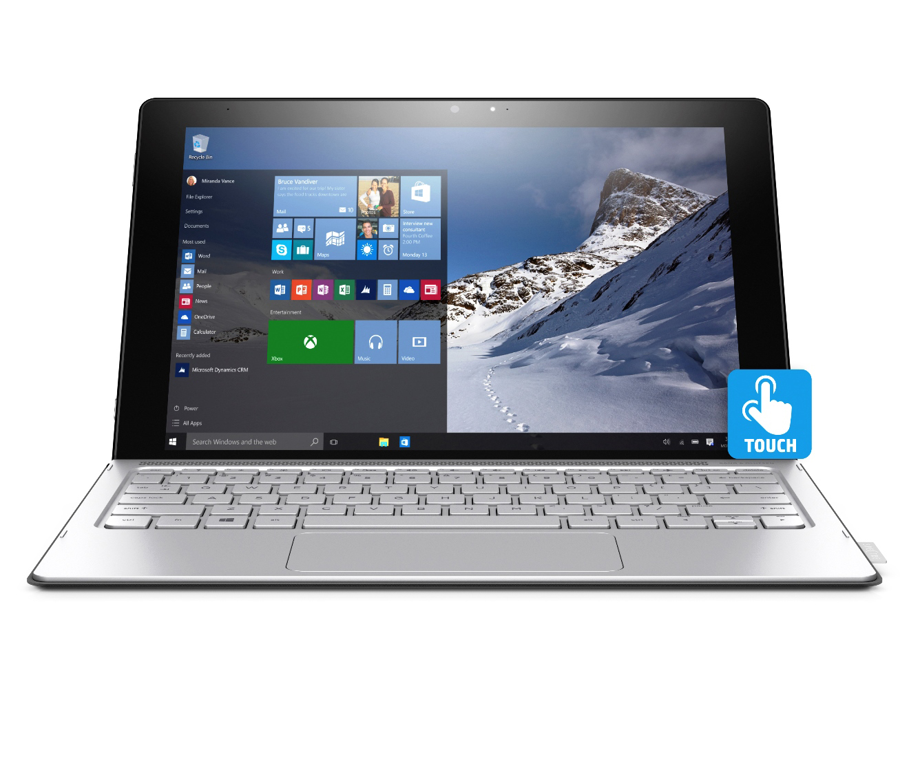 Ein silbernes Convertible-Notebook mit Touchscreen, verschneiter Berglandschaft als Hintergrund und Windows-Startmenü.