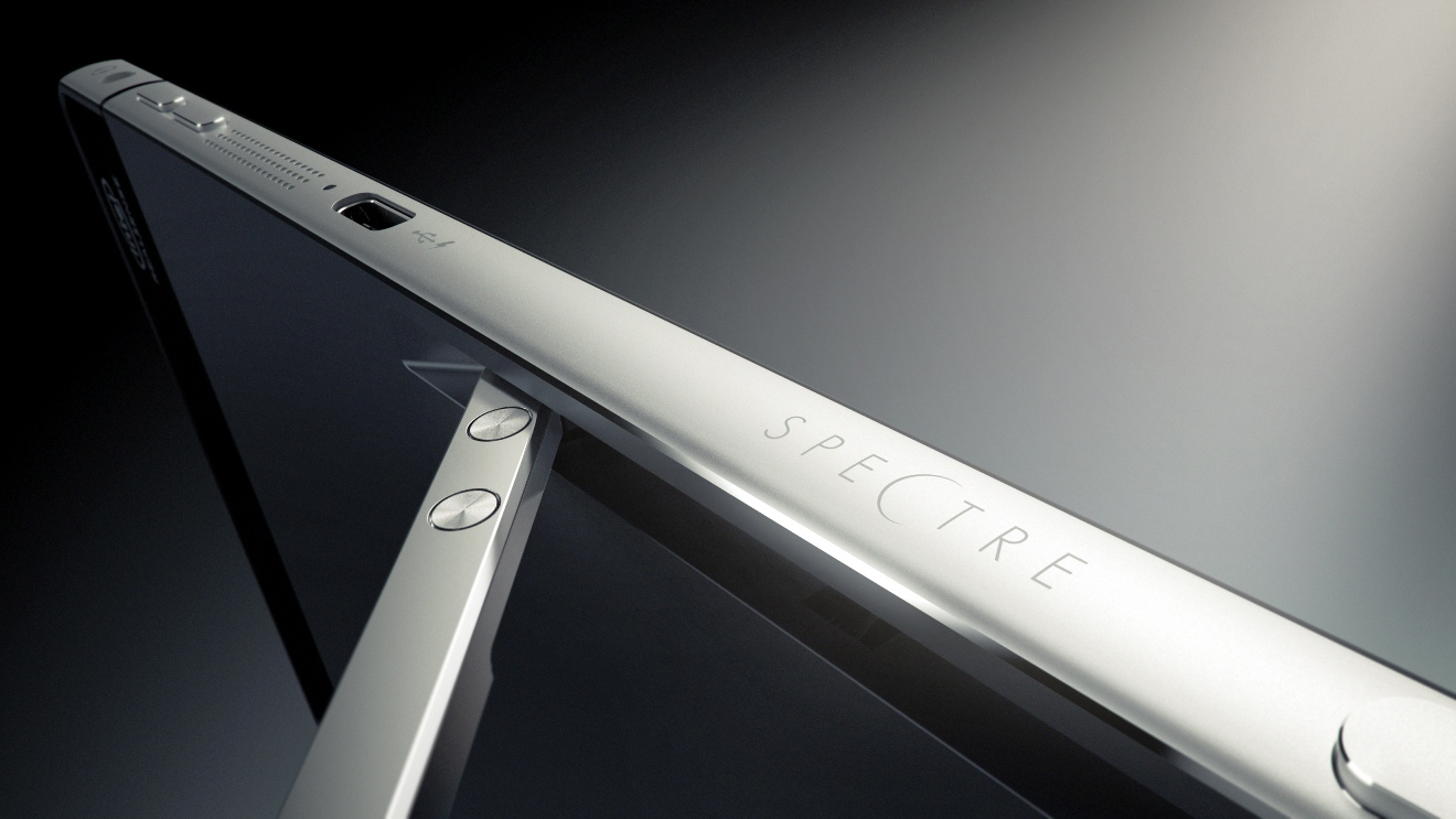 Nahaufnahme eines silbernen HP Spectre Laptops mit dem eingravierten Markennamen auf dem Gehäuse.