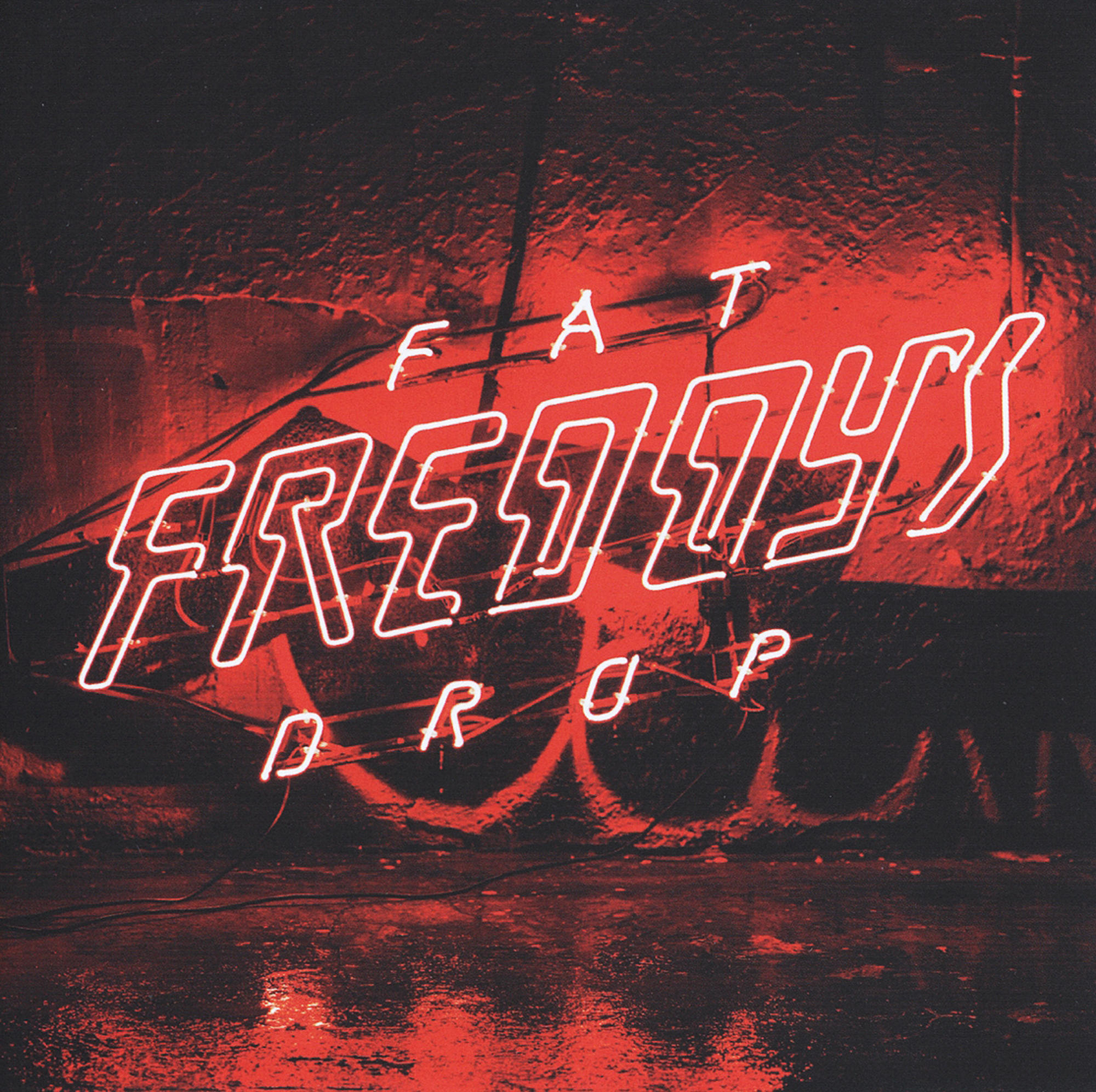 Albumcover mit rotem Neon-Schild, das 'FAT FREDDYS DROP' auf dunklem Hintergrund zeigt.