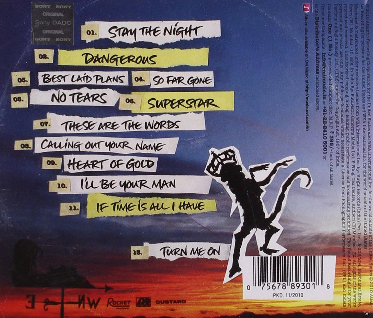 CD-Cover mit Songtiteln und einer Affen-Silhouette. Weiße, schwarze und gelbe Farben.