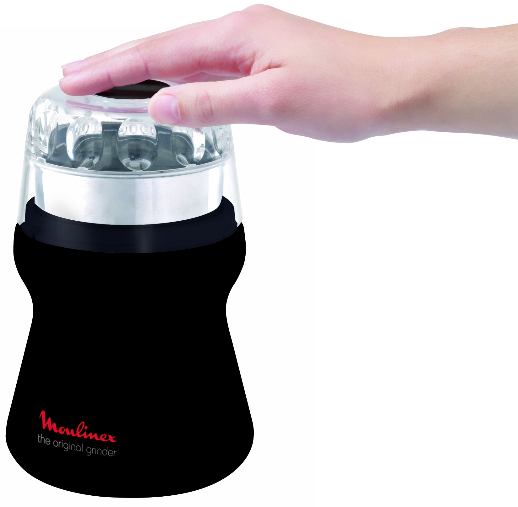 A black and clear electric grinder, with a hand of a person on the top.