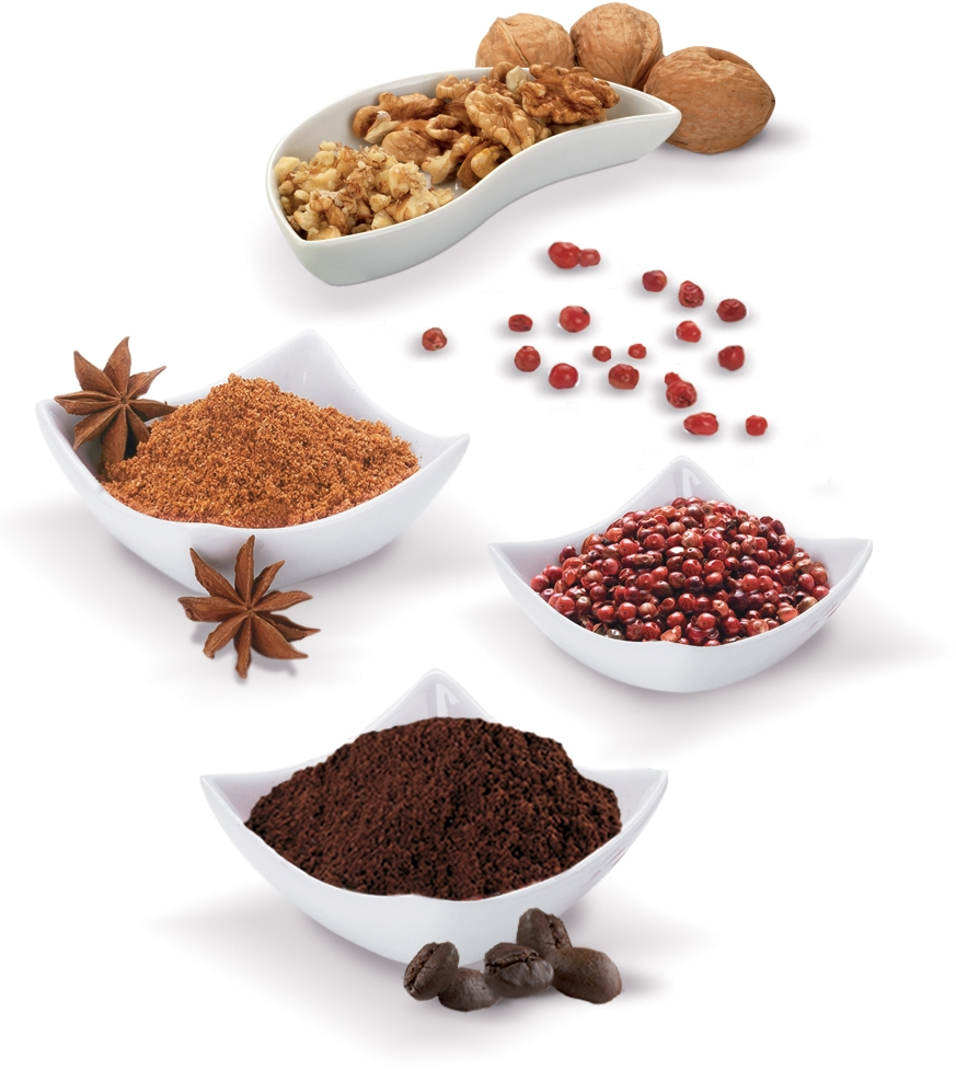 Various spices in white bowls, including walnuts, peppercorns, and coffee grounds.