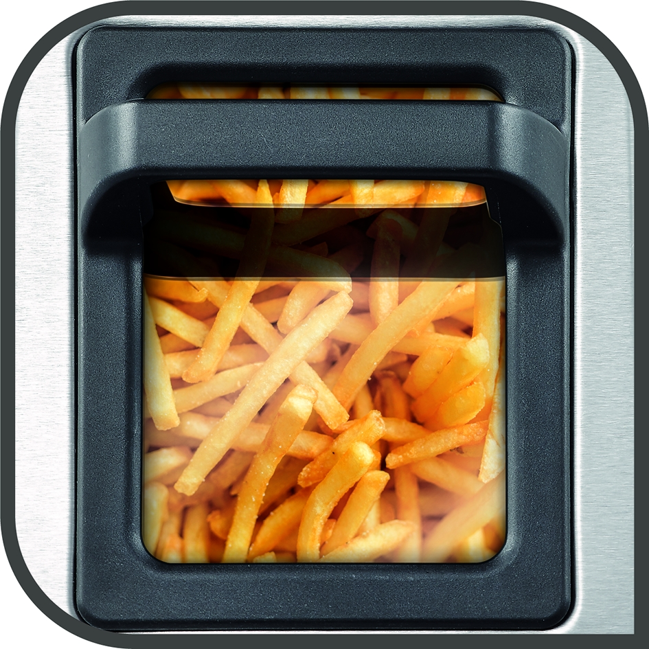 Friteuse à air avec frites visibles à travers la vitre. La friteuse est argentée et noire.