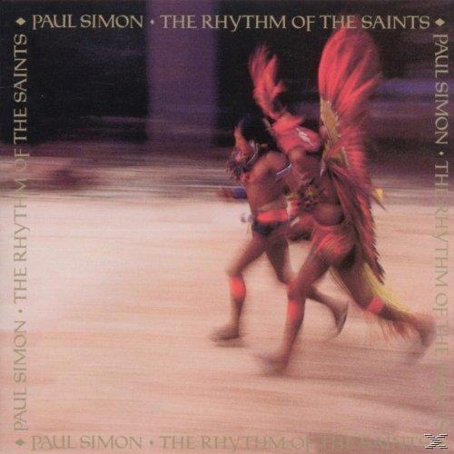 Albumcover von Paul Simon mit zwei Männern, die in roten Federkostümen rennen.
